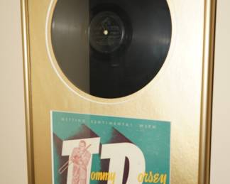 There are several vintage Frank Sinatra album covers and this Tommy Dorsey vinyl and album cover-framed. 