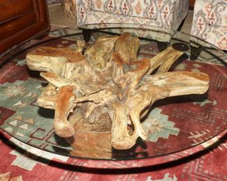 Genuine Mesquite log glass topped coffee table.  There are two smaller end tables that match.