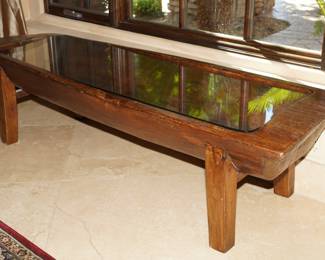 Carved log glass topped coffee table-our client originally paid $3800.00 for this fine piece. 