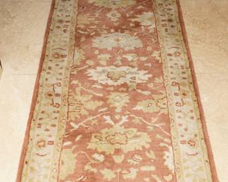 This particular rug is a Kalleen Wool Rug from Pottery Barn. There are several floor rugs and runners available for sale; many are wool. 