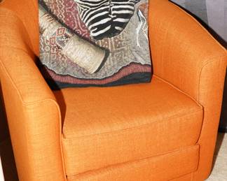 Mid century inspired orange bucket swivel chair