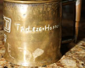 Artillery cup with bullet for handle