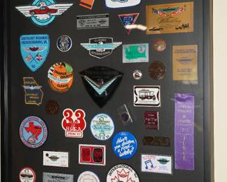 There are 3 shadowboxes of vintage car show awards and car memorabilia. 
