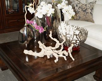 Ethan Allen dark wood coffee table with Z Gallerie corals, bowls, and Pottery Barn candle sticks