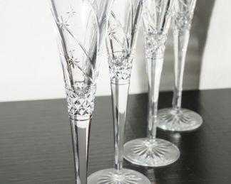 Waterford Millenium champagne flutes. There are several pair of these champagne flutes available-with different etchings.