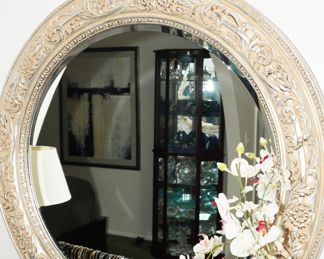Round wood framed wall mirror