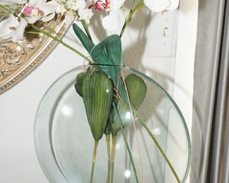 Round glass vase with faux orchids