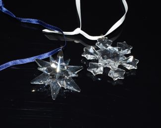 There are several Swarovski crystal ornaments available from many different years. There are also several miniature Swarovski crystal sculptures for sale; including a baby grand piano, a starburst tree topper, red rose flower pots and more.