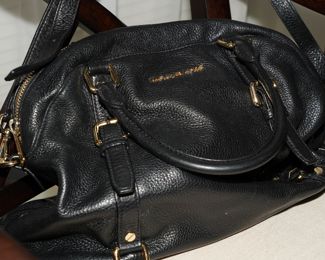 There are several "virtually New" Michael Kors handbags for sale.