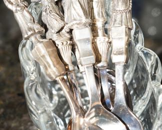 These miniature spoons are Christmas related figures, Santa, Mrs. Claus and more.