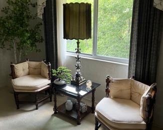 Chairs, side table, lamp, and decorative items