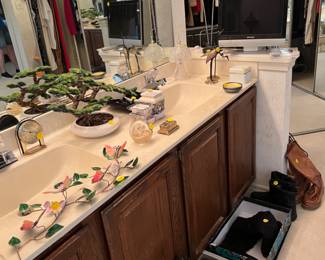 Lots of clothes, shoes, boots, and decorative items