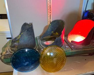 Stop Light, has some chipping on the two bottom shades, no light bulbs on the two bottom one as well. Lights up when plugged in. $150.00
