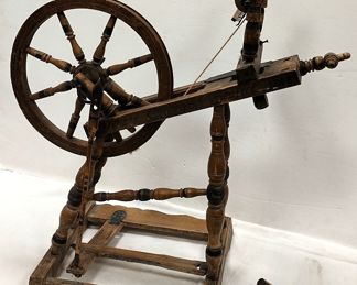  ANTIQUE SPINNING WHEEL. SIGNED. INCLUDES ONE EXTRA AS IS SPOOL. 31" TALL