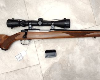 RUGER 77/22 MODEL HORNET RIVLE WITH TASCO SCOPE AND SLING STUDDS INSTALLED. INCLUDES BAG
