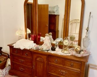 Large dresser with mirror, lamps, clocks, doll, etc.