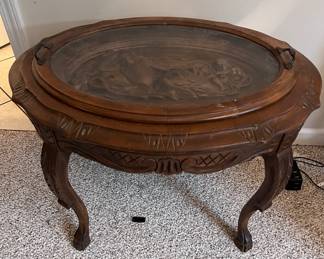 Vintage carved side table with glass tray top