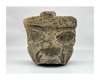 Ancient Olmec Were-Jaguar Stone Head | Carved stone The facial features are common among Olmec figures and represent the were-jaguar motif, which depicts a human-jaguar supernatural figure with exaggerated down-turned mouth, cleft head, and almond-shaped eyes. The term were-jaguar refers to the merging of human and jaguar characteristics, an analogy with the term werewolf. Although interpretations of the were-jaguar vary, the incorporation of animal attributes suggests that the Olmec held animals in high regard and may have attempted to channel the power of such creatures. Date: Circa. 900-350 B.C. | Approx. Size: 8" H x 7.5" W x 6" D.