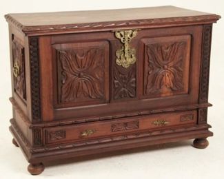 Antique Hand Carved European Red Elm Lift Top Coffer. A substantial heavily carved chest crafted to be an heirloom for future generations. Includes a removable shelf and brass hardware. Dimensions: 31"H X 43"W X 21"D. 