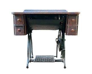 Antique 19th Century Wheeler Wilson (Singer) Sewing Machine D-9 With Original Table | Machine is marked Wheeler & Wilson MFG Co., Bridgeport Conn. D9. Patented Jul. 17th 88. Mar 25th 90. Aug. 2nd 92. No. 2981281 | Also with gold medallion embossed with "Wheeler & Wilson M'fg Co., Bridgeport, Conn. U.S.A." Approx. Measurements: 29.25" High with Sewing Machine Folded In; Opened: 47" L (When Opened); Closed: 32 1/8" L; 16" W.
