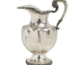 Large Sterling Silver Water Pitcher. Beautiful acanthus scroll handle, lobed body, cast decorative bands around spout and foot, marked underfoot 925 Sterling. Approx. Size: 11.5" H, Weight: 36.23 ozt.