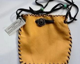 Leather work and jewelry by the artist's daughter