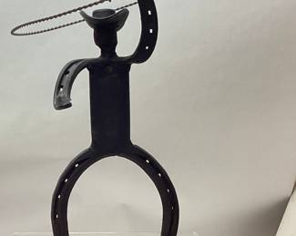 HORSESHOE LASSO COWBOY SCULPTURE