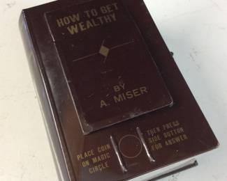 VINTAGE SKELETON HAND TIN BANK