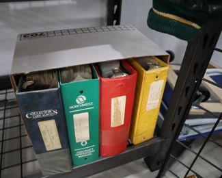 Large binders filled with sports cards: football, hockey, soccer, etc.