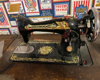 ANTIQUES SINGER SEWING MACHINE IN ORNATELY CARVED CABINET