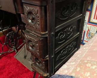 ORNATE CARVING ON SEWING MACHINE DRAWERS