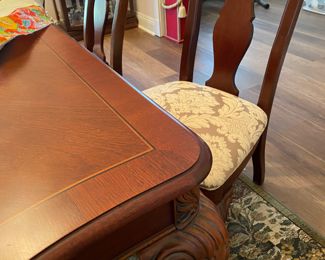 Corner of Dining table. Mint condition. Has two more leaves! This complete dining room is a Thomasville. Truly beautiful and heavy! Good stuff