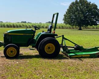 John Deere 790 tractor with bush hog. Less than 300 hrs.  Serviced recently, only used to cut grass.   2007. Has a bump in front, just cosmetic 