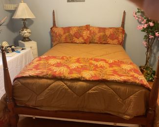 Beautiful queen size custom built walnut bed with very good mattress and box spring.