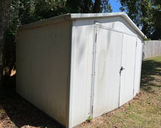 Vinyl tool shed with double doors. Must  be moved.  8’x10’. 