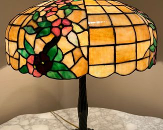 Antique Chicago Mosaic Table Lamp in a beautiful floral design and measuring about 25 inches tall. Features a single socket and pull chain.  Marked on the base of the lamp 
