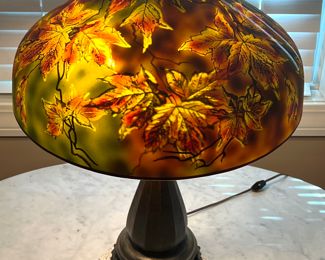 Antique (Attributed to) Jefferson Autumn Leaves Reverse Painted Table Lamp. 

This lamp is simply stunning, it provides a relaxing, calming feel throughout the room when illuminated. 

The lamp is not marked, however; the clients report the shade is by Jefferson and the lamp base is by Handel. Measures about 28.5" high. In very good condition with some very small chips in the inner rim on the top by the finial so they are hidden by the finial hardware. 