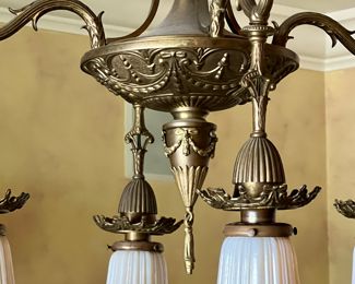 Gorgeous Dining Room Chandelier Four with Quezal Glass Shades. 

A beautiful ornate brass intricately designed fixture paired with four beautiful Quezal white and Aurene glass shades. 

Measures about 35" long and 19" wide with each shade measuring about 4.5" long. 