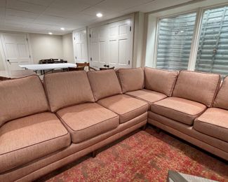 Merchandise Mart Sourced Two-Piece Sectional Sofa Upholstered in Salmon-Colored JF FabricsHigh-Performance Fabric with Leather Trim. Left Section Measures 74" L x 38" D; Right Section Measures 88" W x 38" D. Photo 1 of 5.