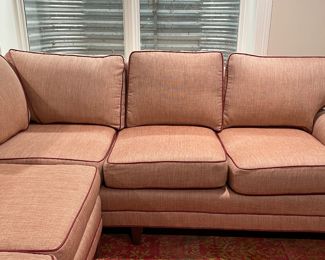 Merchandise Mart Sourced Two-Piece Sectional Sofa Upholstered in Salmon-Colored JF Fabrics High-Performance Fabric with Leather Trim. Left Section Measures 74" L x 38" D; Right Section Measures 88" W x 38" D. Photo 5 of 5.