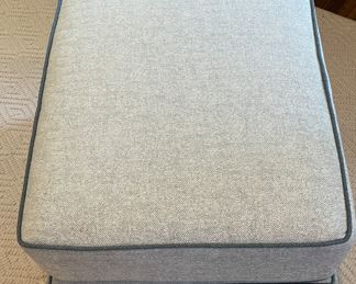 Kravet Ottoman Upholstered in Light Grey Herringbone Fabric with Contrasting Dark Grey Faux Leather Trim. Measures 22" x 28" x 21" H. Photo 3 of 3.
