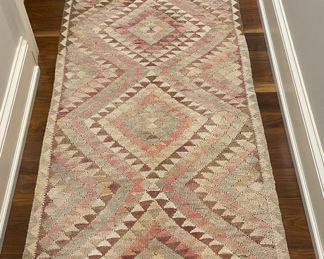Vintage Turkish Kilim With Pink Hues. Measures 9' 4" x 2' 7". Photo 1 of 3.
