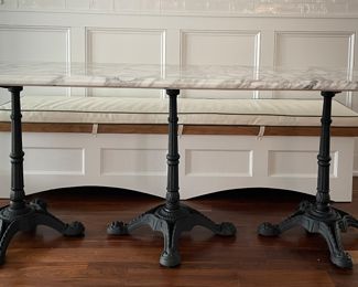 Calcutta Gold Marble Top Three-Pedestal Bistro Table with Wrought Iron Base. Measures 80" L x 26" D x 31" H. Photo 1 of 4.