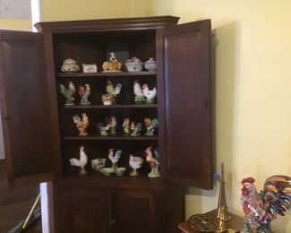 NC made corner cupboard with raised panel inside doors.  Collection of Italian and novelty ceramic chickens from 50"s. 