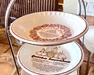 Adorable pie rack with recipes on plates 