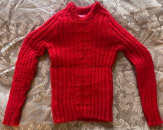 Little girl’s red sweater
