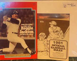 The Picture Life of Reggie Jackson book and 1981 Official Baseball Rules booklet 