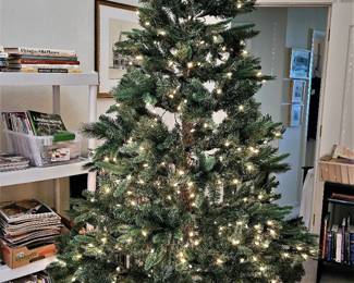 Brand new 7.5 lit Christmas tree we took out of the box. When you put the sections together the lights automatically hook into each other. No cords to plug together.