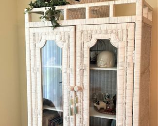 White wicker glass-front cabinet