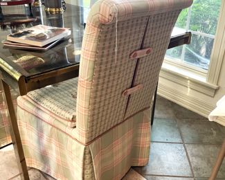 One of four custom upholstered parson chairs